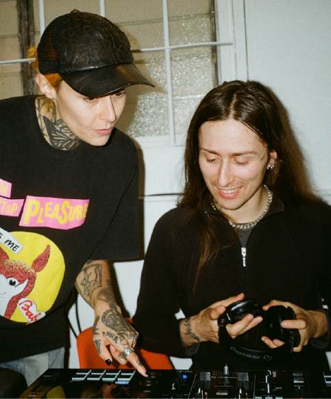 Two attendees practising with a controller