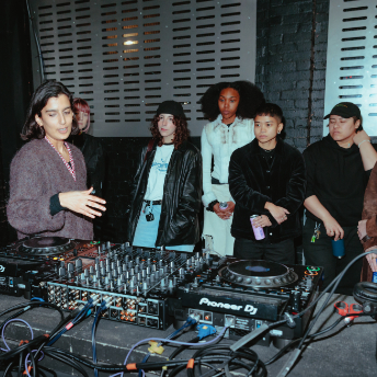 Tutor talking a group of attendees through the mixer at FOLD