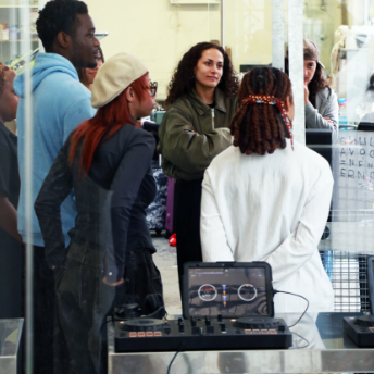 Attendees gathered around a controller outside the venue