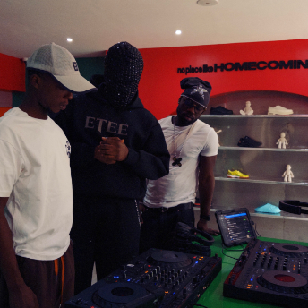 DJs playing in the Homecoming concept store surrounded by sneaker displays