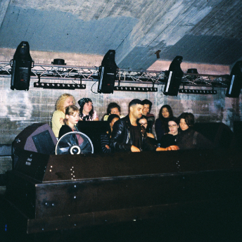 Group gathered in the DJ booth at RADION