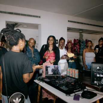 DJ playing to a room of guests at Homecoming Festival