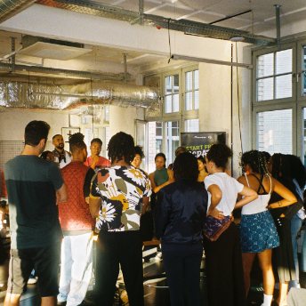 Attendees watching a demonstration in the House of Color loft